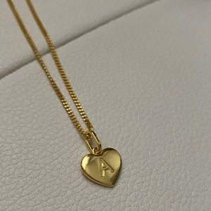 Gold initial letter “A” necklace